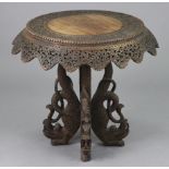 An Anglo-Indian hardwood circular pedestal table, with profusely carved stylised decoration &
