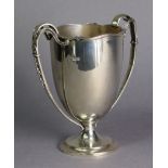 A George V silver two-handled trophy cup with waived reeded rim, the loop side handles with bell-