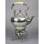 An Edwardian silver tea kettle of inverted pear shape, with bud finial to the removable domed