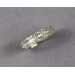 A diamond ring set row of baguettes between two rows of small brilliants, to a white metal shank