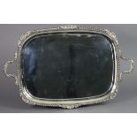 A LATE VICTORIAN SILVER TWO-HANDLED RECTANGULAR TRAY with rounded corners, gadrooned shell & leaf-