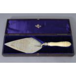 A Victorian silver presentation trowel, the kite-shaped blade with engraved leaf-scroll decoration &