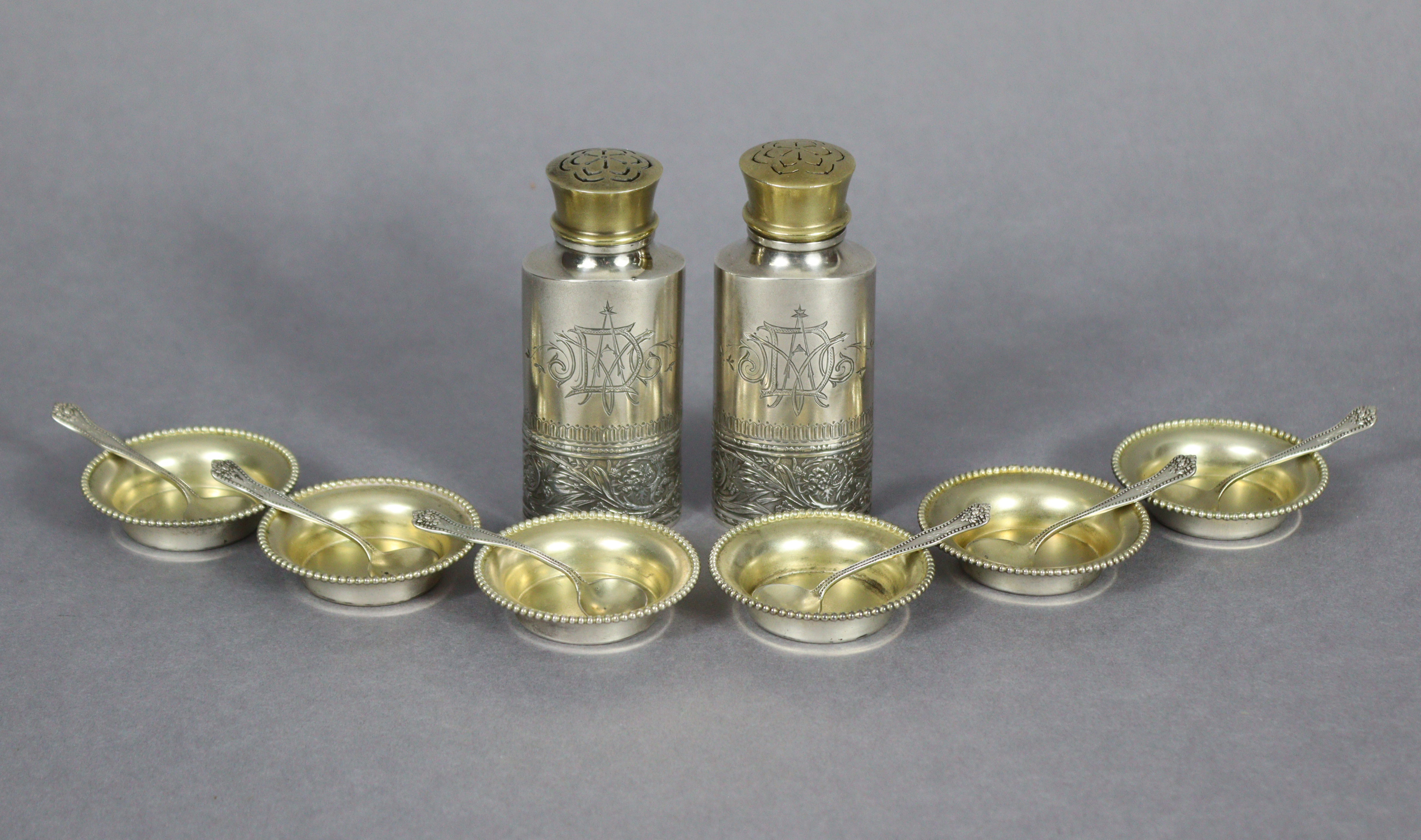 A set of six Sterling small circular salt cellars with beaded rims, 1/75” diam., & six matching salt