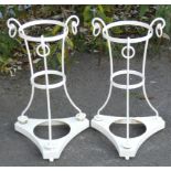 A pair of white painted wrought & cast iron jardiniere stands, in the regency style, of triform