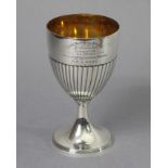 A George III silver goblet with gilt interior, the semi-fluted ovoid bowl with later engraved