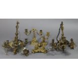 A pair of 19th century gilt metal four branch chandeliers with standing male & female figures