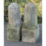 A pair of stone gate-post finials of tall octagonal form, on square bases; each 32” high x 12”