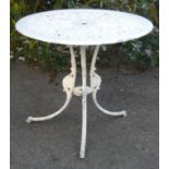 A white-painted aluminium garden table with pierced floral decoration, the circular top on three