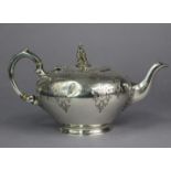 A mid-Victorian silver teapot of compressed round form with engraved decoration, monogram, & date