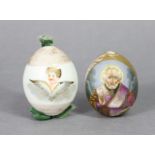 A Russian Imperial Porcelain easter egg painted with a male saint on a gilt ground, 2¼” high; &
