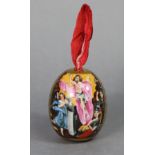 A Russian Imperial Porcelain easter egg with painted religious figure scene on a gilt ground; 3”