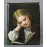 A Continental painted porcelain plaque depicting a young girl reading a book, impressed numbers “