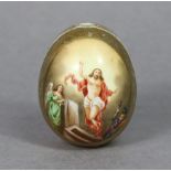 A Russian Imperial Porcelain easter egg painted with Christ risen from the dead, inscription to