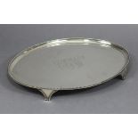 A GEORGE III SILVER OVAL SALVER, the raised border with beaded rim, engraved monogram to the centre,