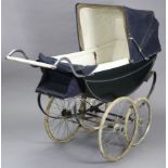 A mid 20th century coach-built pram/perambulator (black) by Millson of London, with spoke wheels,