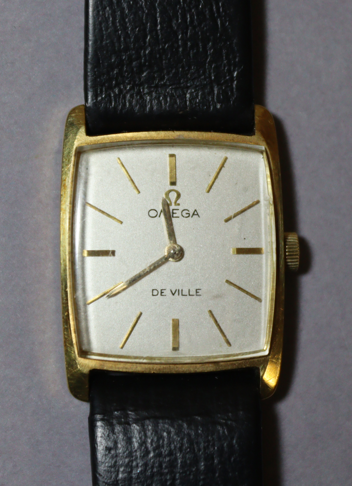 An Omega De Ville 18K ladies' wristwatch , the square silvered dial with gold hands & baton numerals