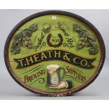 A reproduction painted wooden oval sign: “T. HEATH & Co. BREWING SUPPLIERS”, 30¼” X 35”.