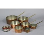 A set of seven copper graduated saucepans, each with brass side handle marked “Touraus”, 3.25” to 8”