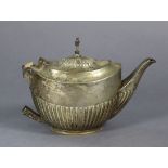 A George V silver teapot of oval semi-fluted design (lacking handle), Sheffield 1930, 6½” wide.