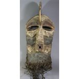 A large Songye Kifwebe male mask with curved crest, square protruding mouth, the sides with deep gro