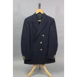 A navy blue blazer jacket with brass buttons, tailored by H. Huntsman & Sons Ltd. of Saville Row, 3