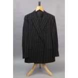 A black suit jacket with red and grey pinstripes, with matching trousers, tailored by H.