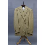 A fawn coloured suit jacket with matching waistcoat and trousers, tailored by Hunstman & Son Ltd. o