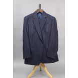 A navy blue pinstriped suit jacket and matching trousers, tailored by Huntsman & Son Ltd. of Savill