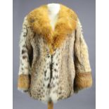 A silk-lined ladies’ fur coat with red-fox fur collar, bears label “Ewirn, London”.