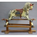 A VINTAGE DAPPLE-GREY PAINTED WOODEN ROCKING HORSE ON PINE TRESTLE BASE, probably by J.