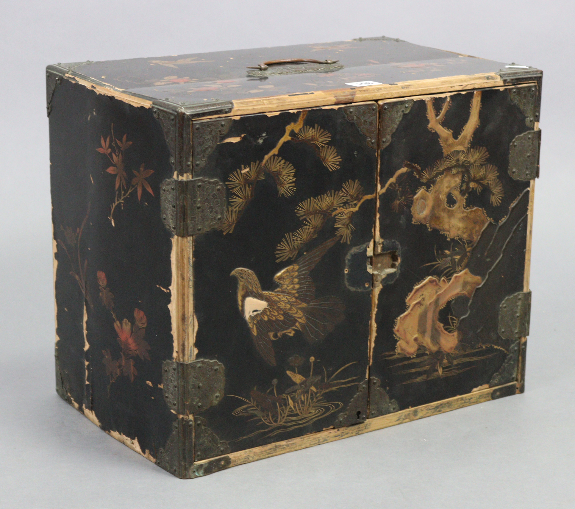 A Chinese black & gold lacquered table-top cabinet fitted with an arrangement of five drawers & a