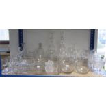 Four glass decanters (three with stoppers); a set of four cut-glass drinking vessels, 5¼” high; &