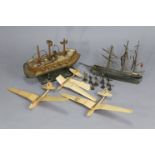 Eight painted lead African bandsmen figures; together with two wooden model ships; & three balsa