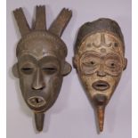 A tribal mask, possible Biombo, the head with three carved crests, 16"; & another, possibly Lulua,