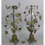 A pair of ornate metal table candelabras with vine-leaf decoration & on triform bases, 28¼” high.