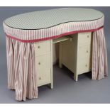 A white painted wooden kidney-shaped dressing table (with drapes), 42” wide.