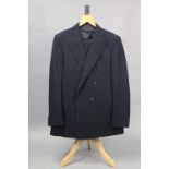 A navy blue suit jacket and matching trousers tailored by H. Huntsman & Sons Ltd. of Saville Row,