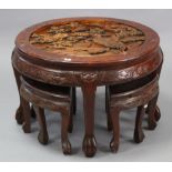 An eastern carved wooden nest of five occasional tables (four under one) the larger table 29½”