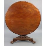 . A 19th century mahogany “loo” table or dining table with a circular tilt-top, & on an octagonal