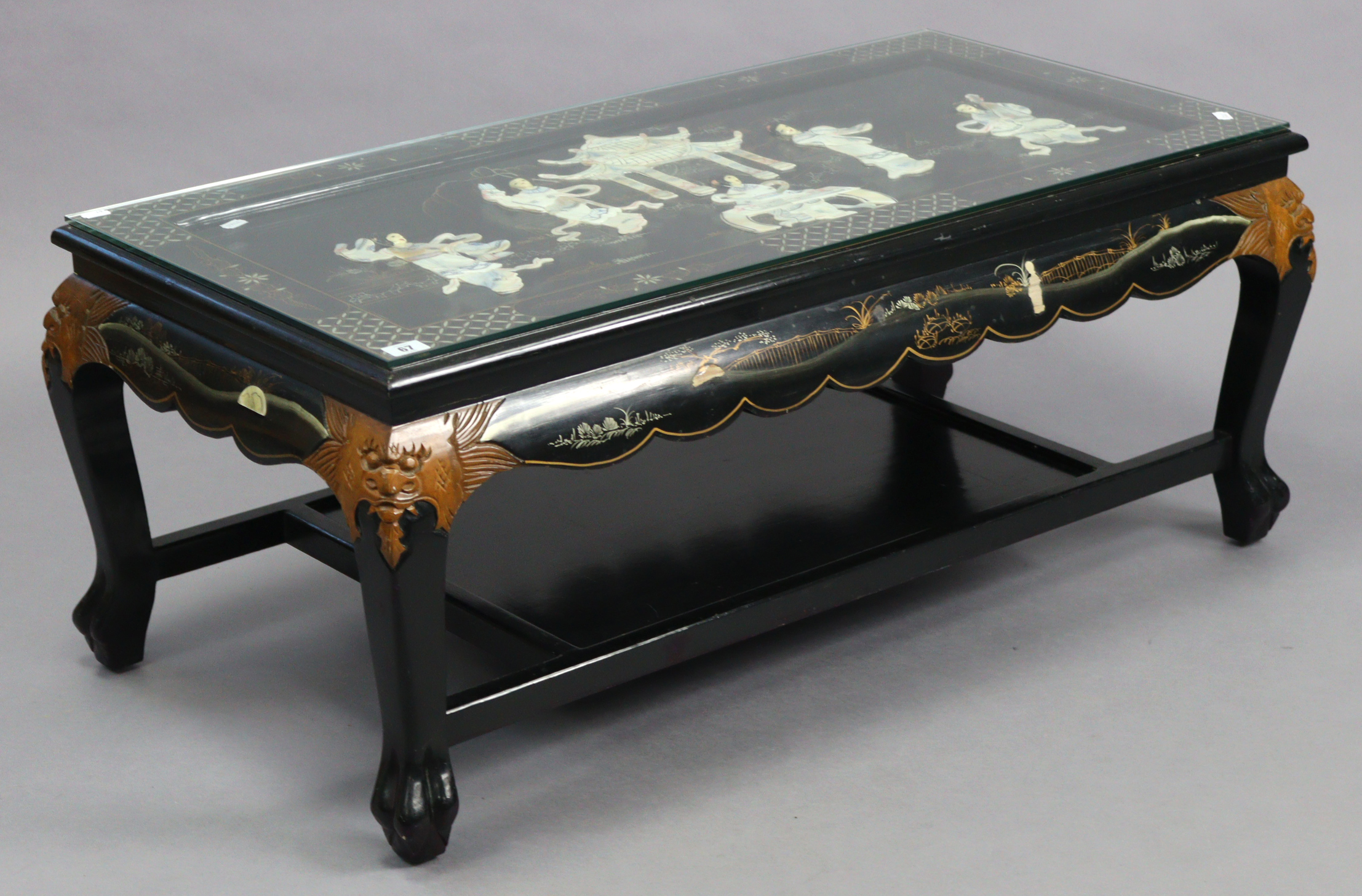 A Chinese-style black chinoiserie rectangular two-tier low coffee table with coloured figure-scene