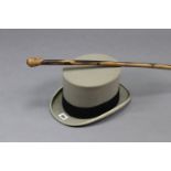 A Lock & Co. Of St. James Street, London, grey felt top hat; & a wooden walking cane with carved