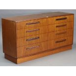 A G-Plan teak double chest fitted two ranks of four long drawers, & on a plinth base, 56” long x 30”