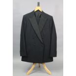 A black dinner jacket with matching trousers, tailored by H. Huntsman & Sons Ltd. of Saville Row, 1