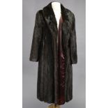 A mink fur silk-lined three-quarter length ladies’ coat, bears label “Edelson”.