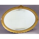 A large gilt frame oval wall mirror inset bevelled plate (slight faults), 30½” x 41”.