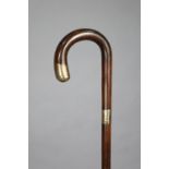 A vintage rosewood gent’s walking cane with two 9ct. gold mounts, 35.75” high.