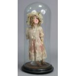 An Armand Marseille bisque-head girl doll, 19" high (lacking one hand); together with a glass domed