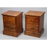 A pair of pine two-drawer bedside chests, 18¾” wide x 25” high x 16¾” deep.