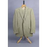A light green & fawn coloured tweed suit jacket and matching trousers tailored by H. Huntsman & Sons