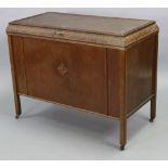 An oak blanket box with a hinged lift-lid, & on short square legs with castors, 36½” wide x 28½”